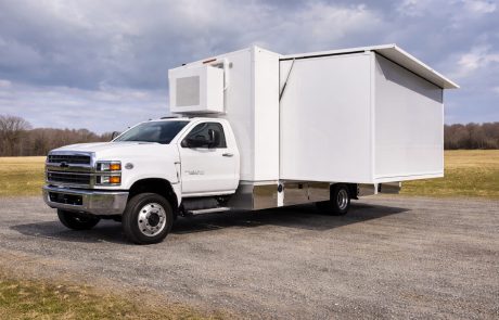 Mobile laboratory truck side view showing compact transport configuration and integrated laboratory unit.